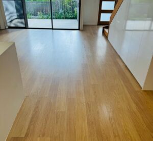 Tenant performing end-of-lease bond cleaning in Gold Coast home.